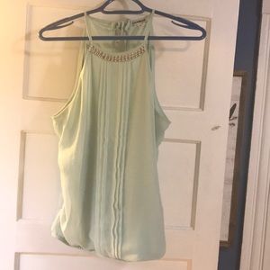 Light teal top with beading along the neckline